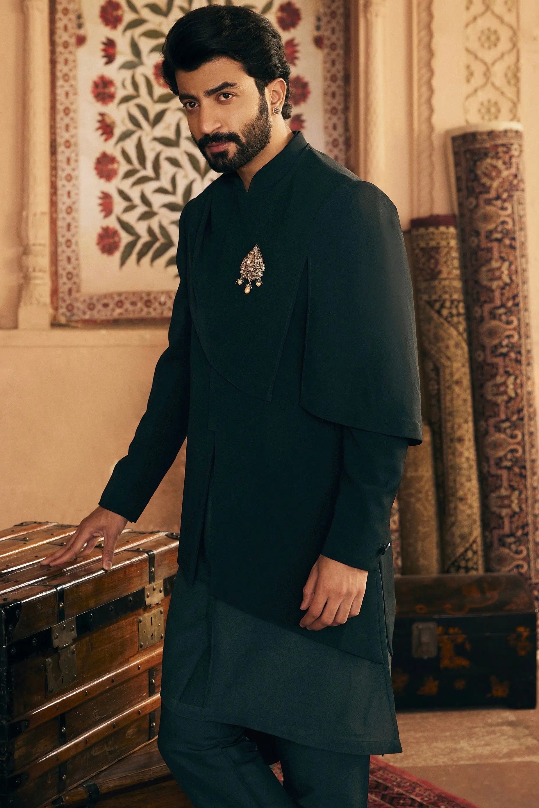 Asymmetric Allure: Indo-Inspired Ensemble with Gilded Brooch Accent