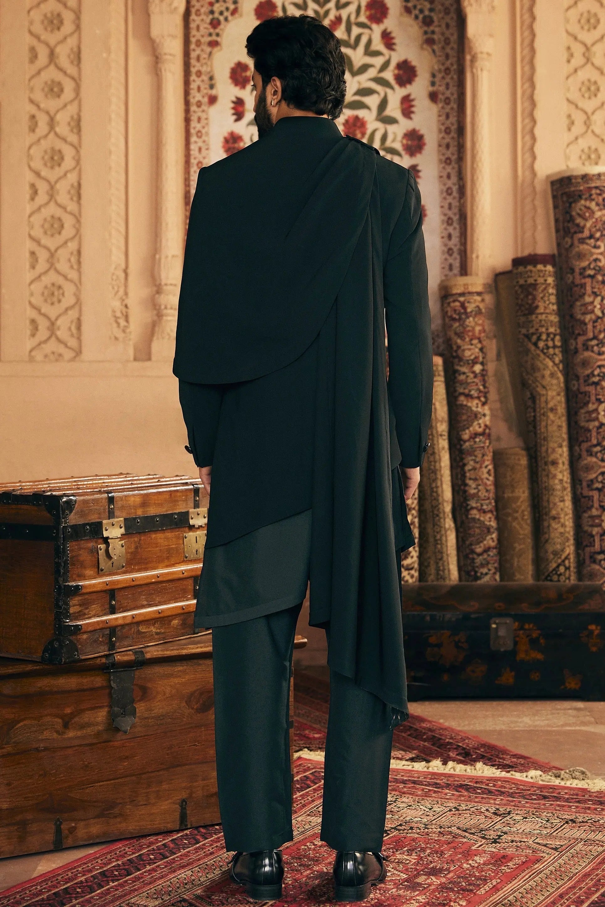 Asymmetric Allure: Indo-Inspired Ensemble with Gilded Brooch Accent